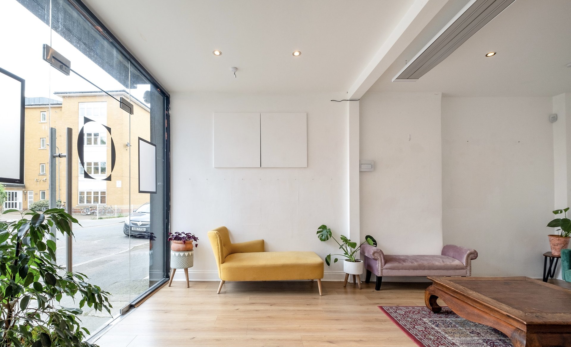 Ground floor with open glass doors to street