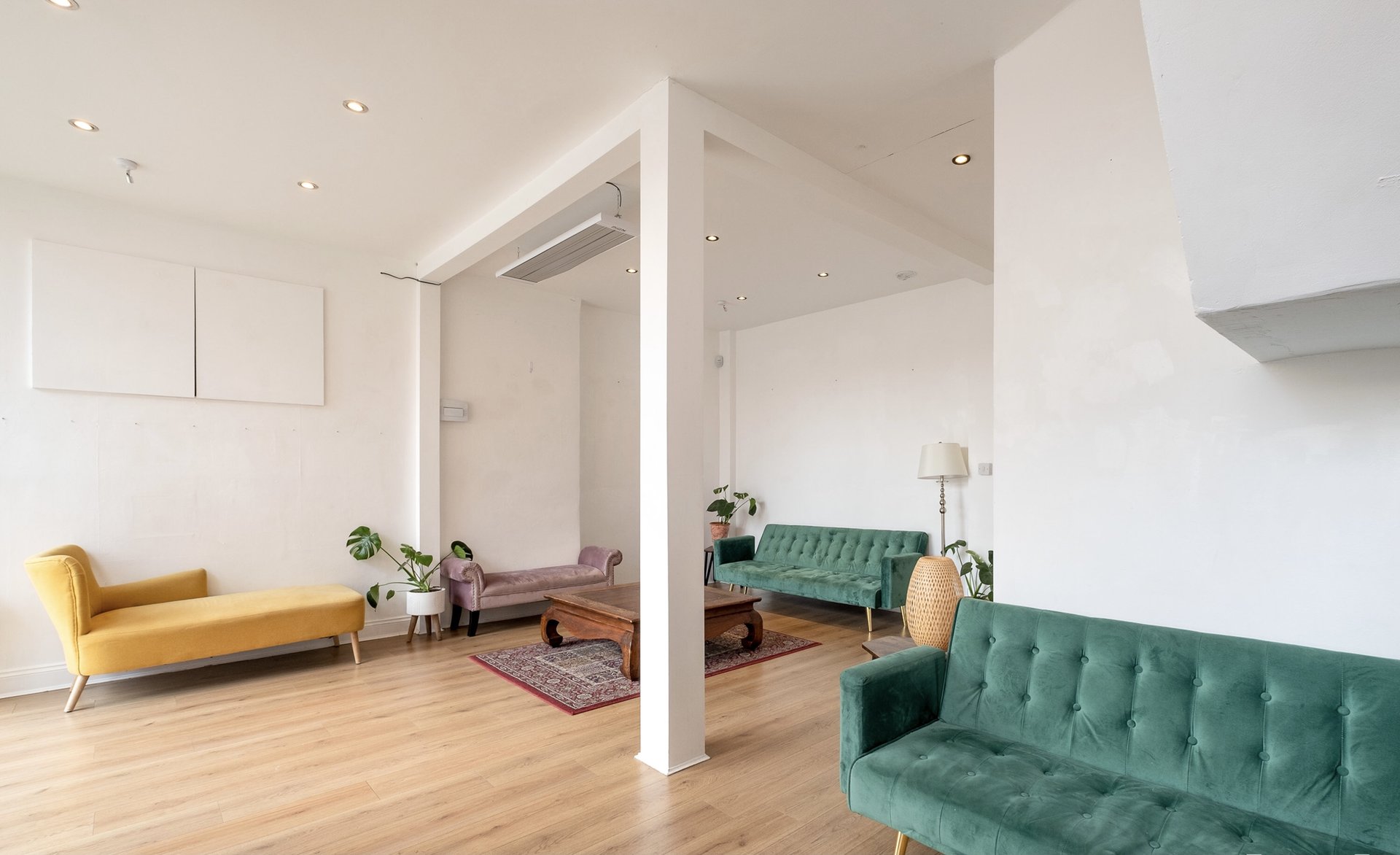 Social space with colourful sofas and plants
